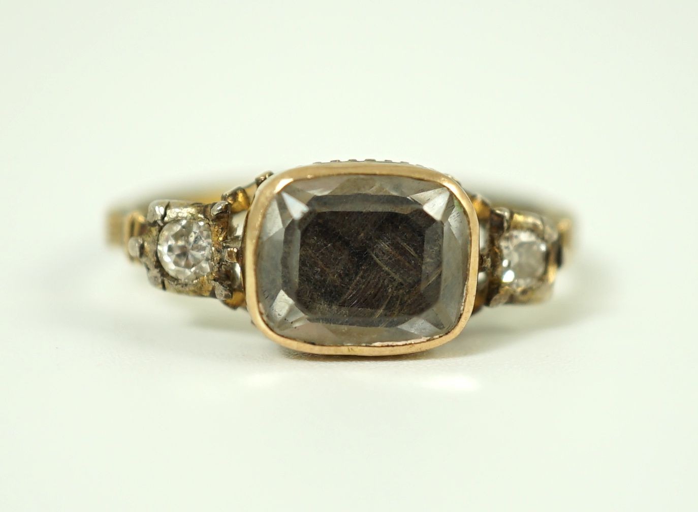 An 18th century gold and rock crystal and diamond set mourning ring